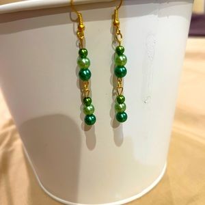 New hand made shades of green glass bead pierced earrings.